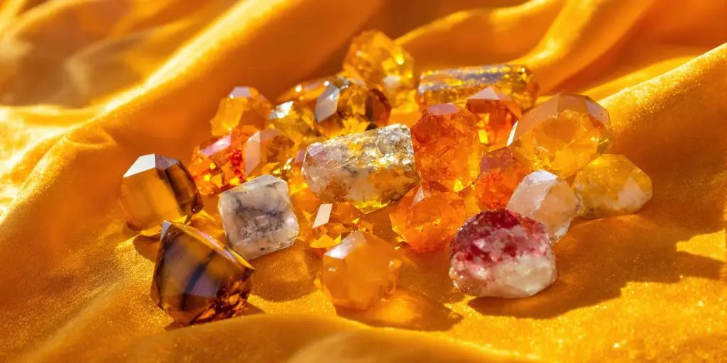 Tiger’s eye, citrine, and carnelian crystals on golden velvet.