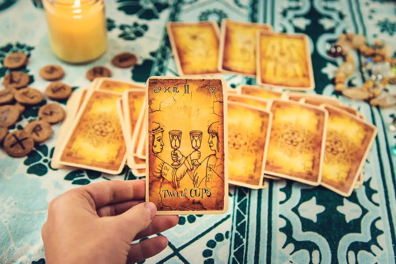 A fortune teller performing a tarot card reading, selective focus.