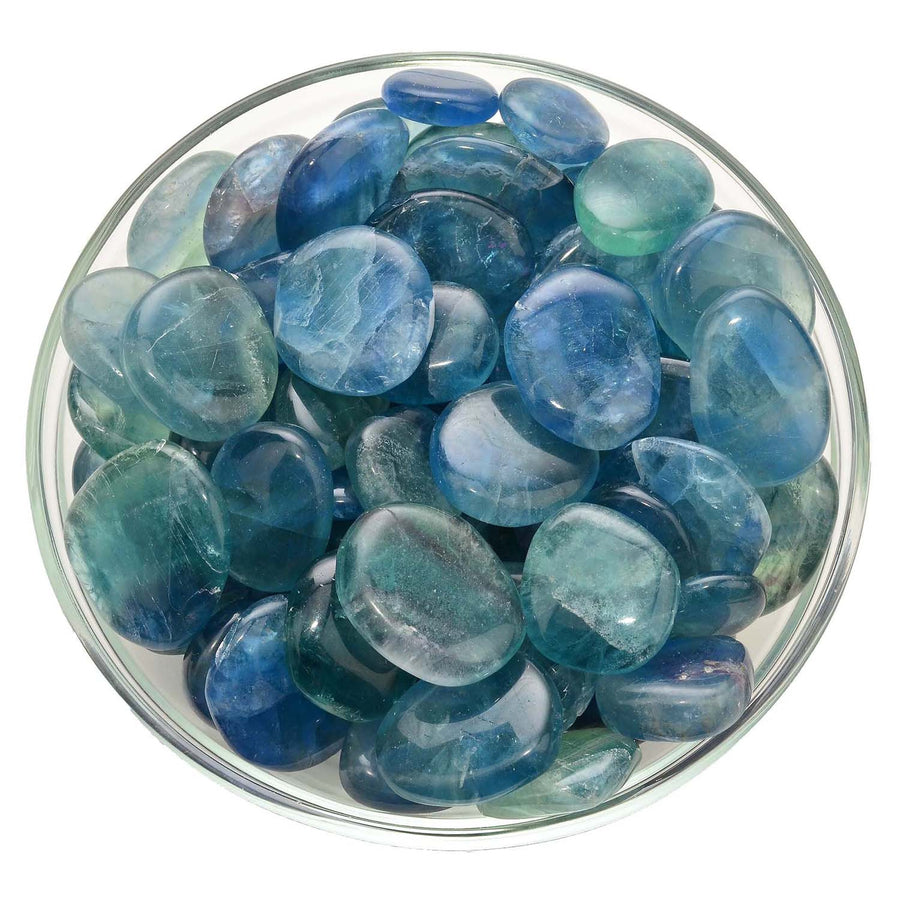 Bowl of polished blue and green Glass Stones, featuring Blue Fluorite Palm Stone