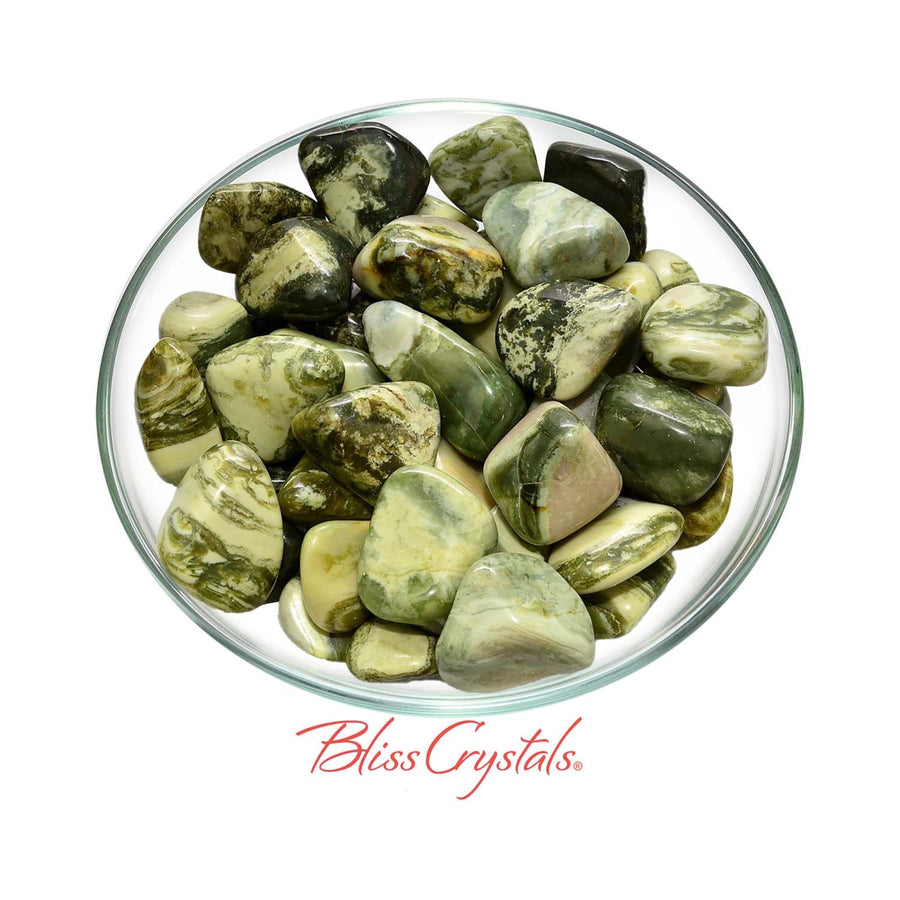 Tumbled green Serpentine crystals in a bowl for Infinite aka Healers Stone