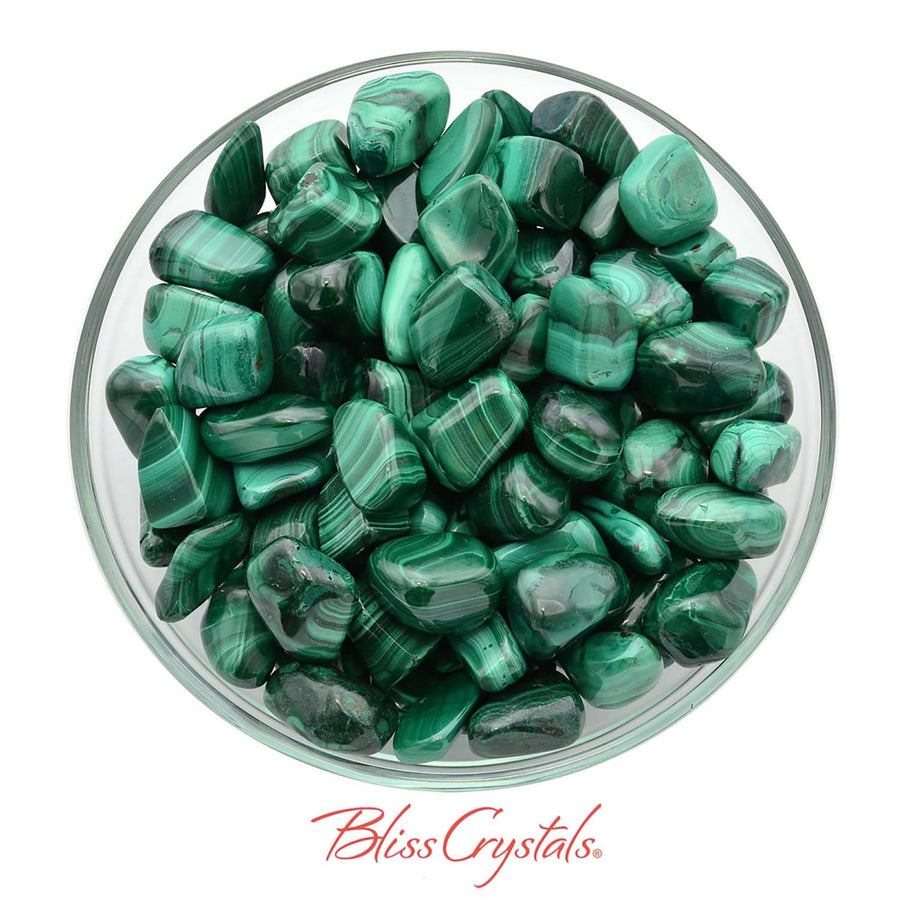 Tumbled Malachite stones with green banding in a glass bowl for protection and health