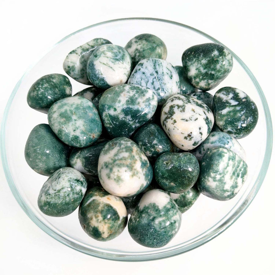 Bowl of green marbles showcasing 1 Moss Agate 1.1’’ Tumbled Stone for item tier benefits