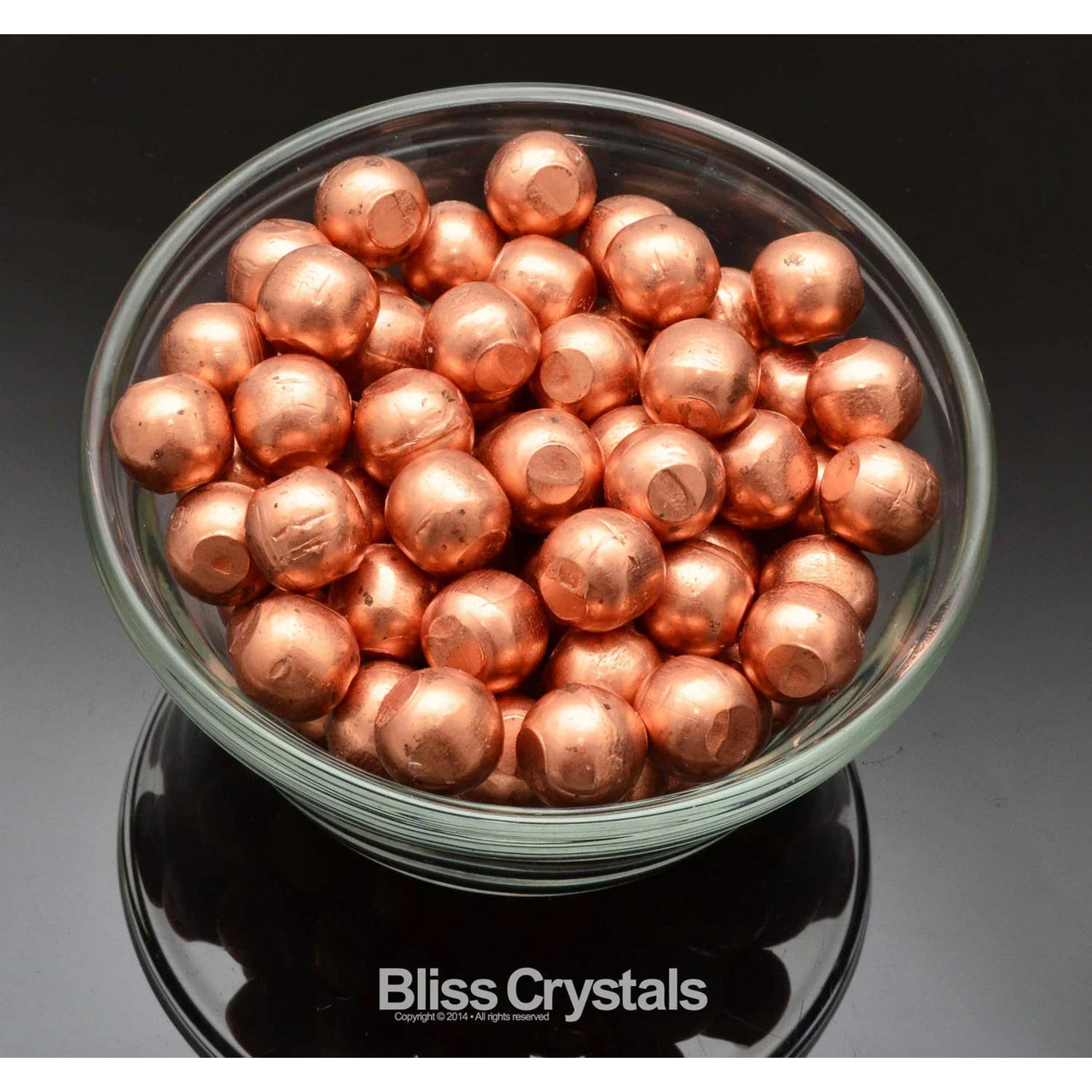 A bowl of native copper foil balls with the 1 Native COPPER Mini SPHERE 1/2’ #CS10