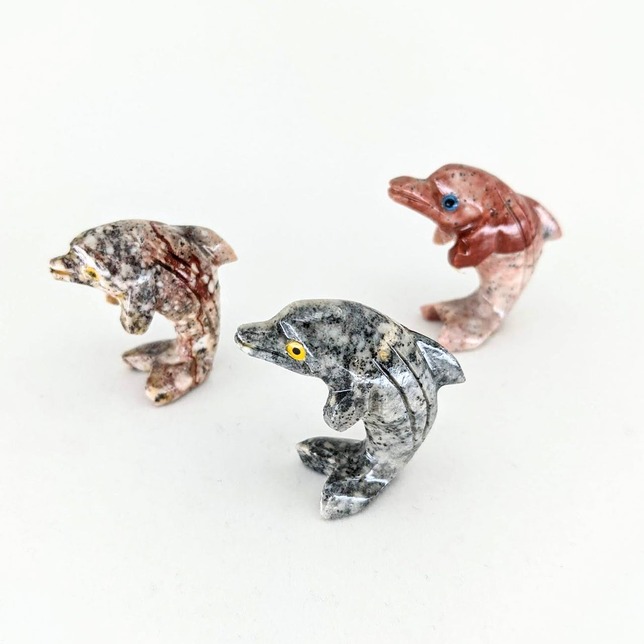 Soapstone Baby Animal Carving from Peru: three small glass animals on a white surface