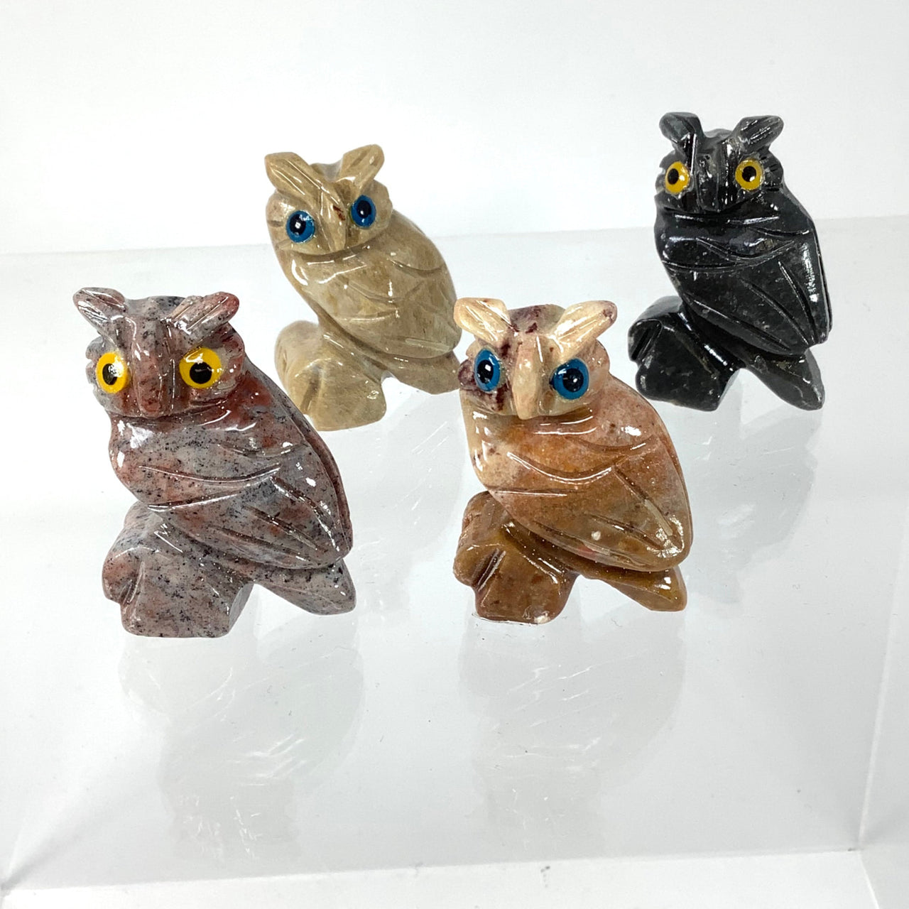Soapstone carving of three baby owls on white surface, Peruvian craft #C005D