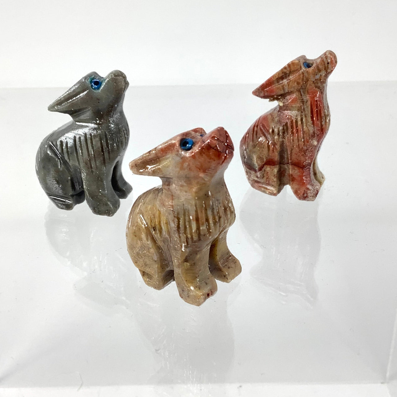 Handcrafted Soapstone Baby Animal Carving from Peru on a White Surface Product Code: C005D