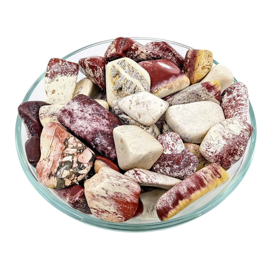 Bowl of tumbled Mookaite Jasper stones featuring red, white, burgundy shades for Alunite Tumble Stone