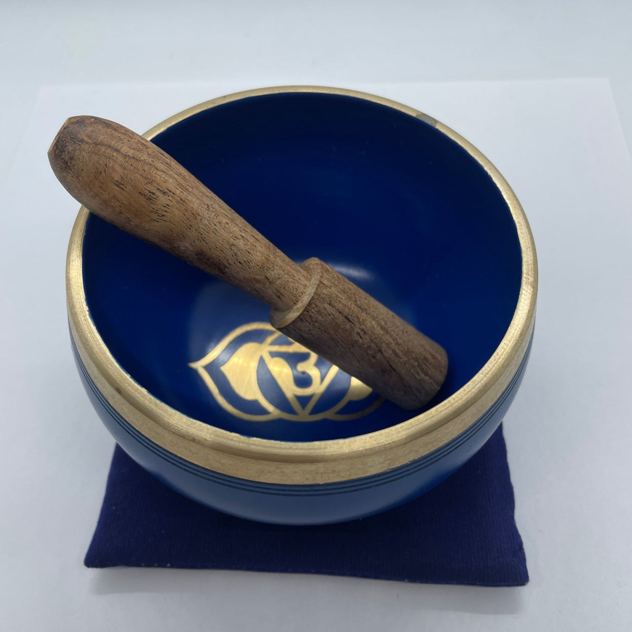 Blue and gold Chakra Singing Bowl with wooden striker in a bowl box set