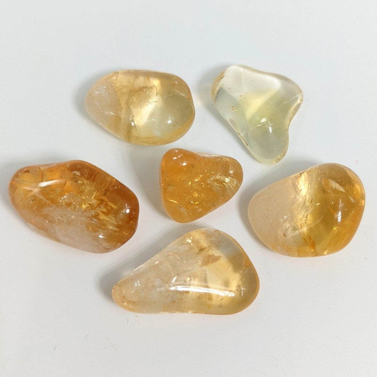 Close up of a 28gm citrine parcel featuring five different colored bliss crystals stones