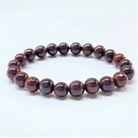 An 8 mm bloodstone bracelet featuring polished deep red garnet beads with subtle golden streaks and a smooth rounded design