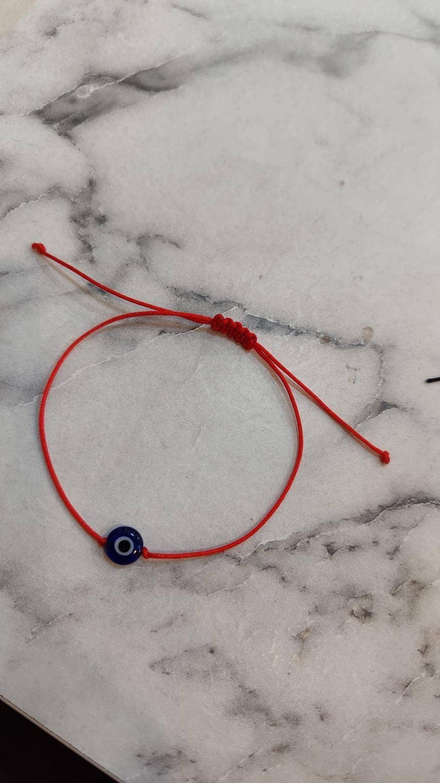 Evil eye wish bracelet with red cord from Evileyefavor SINGLE EYE BEAD #J955