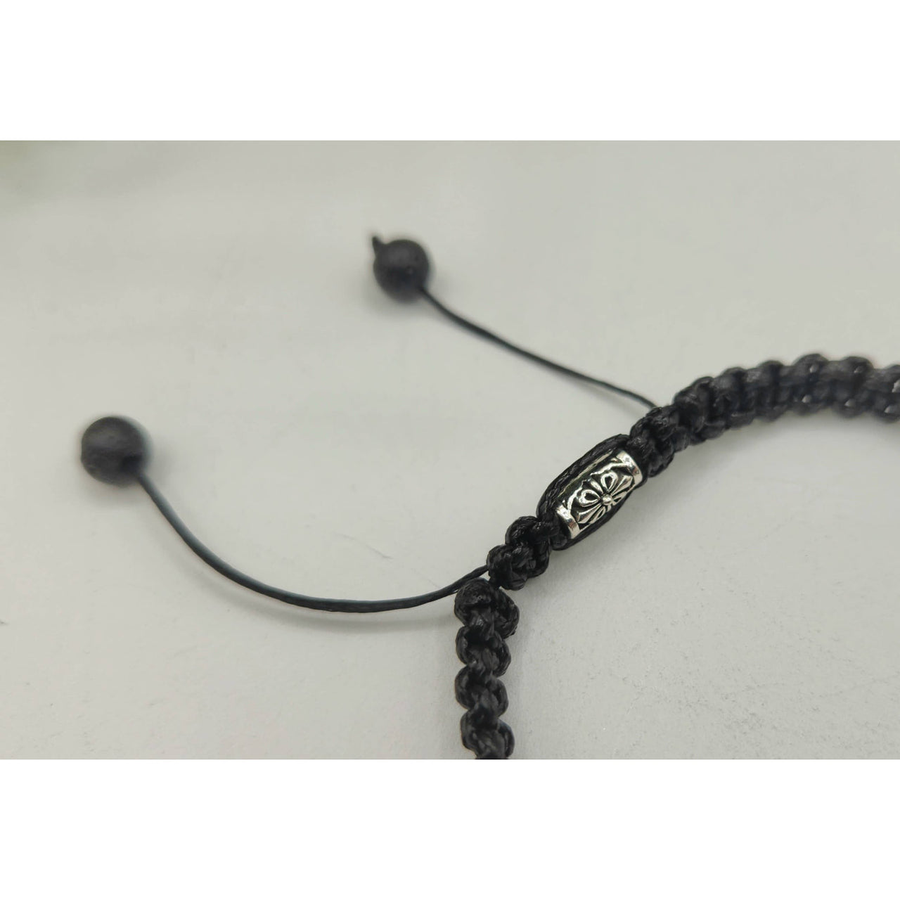 Black braided bracelet with silver accents from ABUNDANCE Tiger’s Eye Jade Citrine Unisex Bracelet