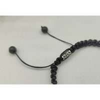 Black braided bracelet with silver accents from ABUNDANCE Tiger’s Eye Jade Citrine Unisex Bracelet