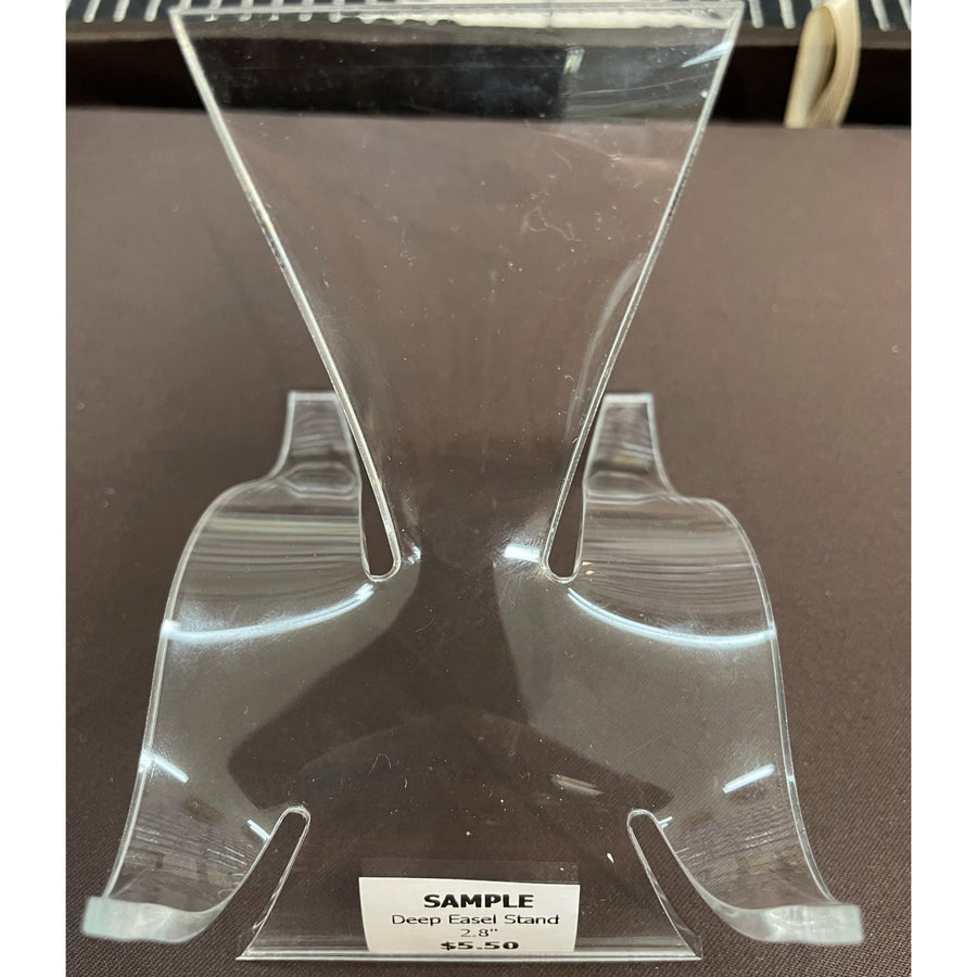 Clear plastic display stand with V-shaped design, ideal for ring holder or easel stand