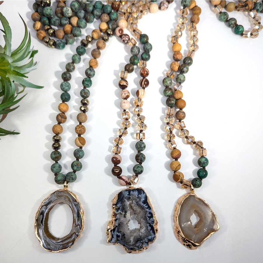 Three beaded necklaces with Agate pendants displayed in African Turquoise and Jasper design