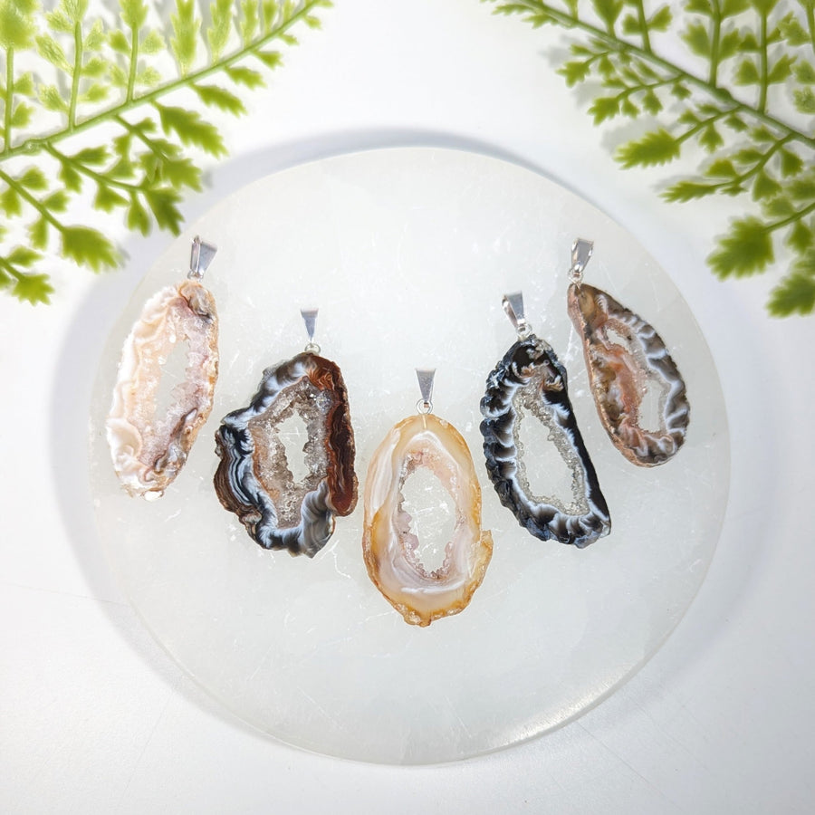 Agate druzy slice pendant jewelry featuring five gemstone charms with natural crystals and silver-toned clasps