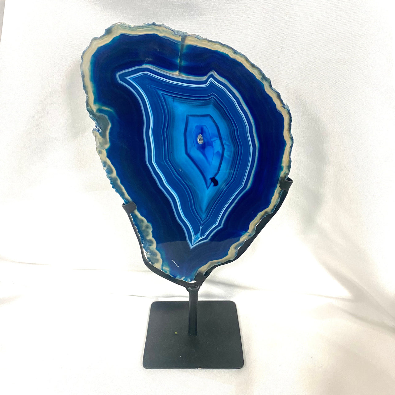 Close-up of blue agate slice with flat shape on black stand - Agate Slice on Metal Stand #M191