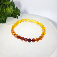 Amber 7’’ Tri-Color Bracelet with gradient yellow to reddish-brown beads