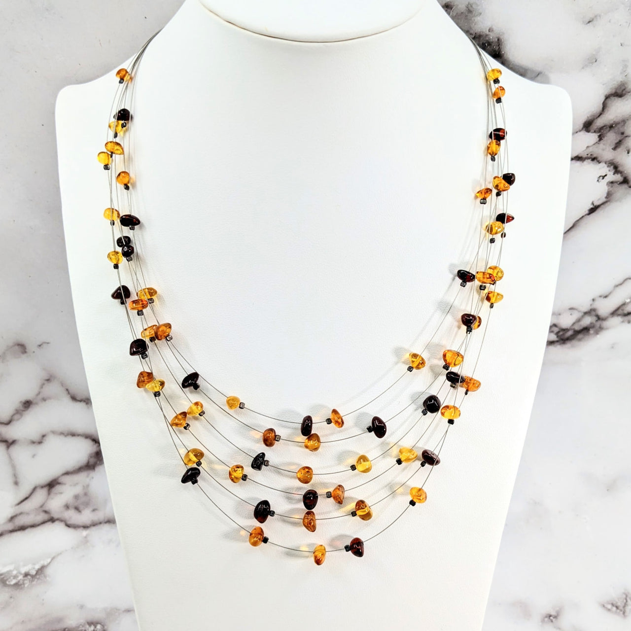 Amber Two Color 22’ Floating Wire Necklace with multi-colored beads and black-orange bead