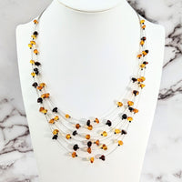 Thumbnail for Amber Two Color 22’ Floating Wire Necklace with multi-colored beads and black-orange bead