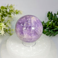 Amethyst 2.2 inch sphere with polished translucent purple crystal and natural crystalline inclusions