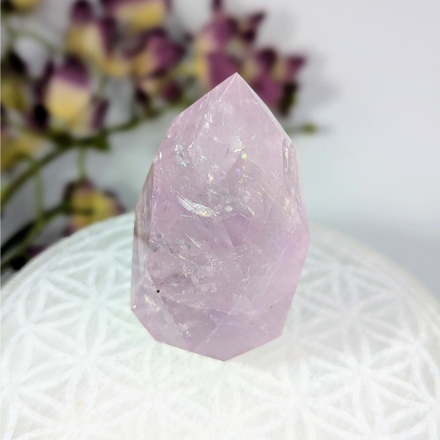 Polished light purple Amethyst crystal point for healing and decorative purposes