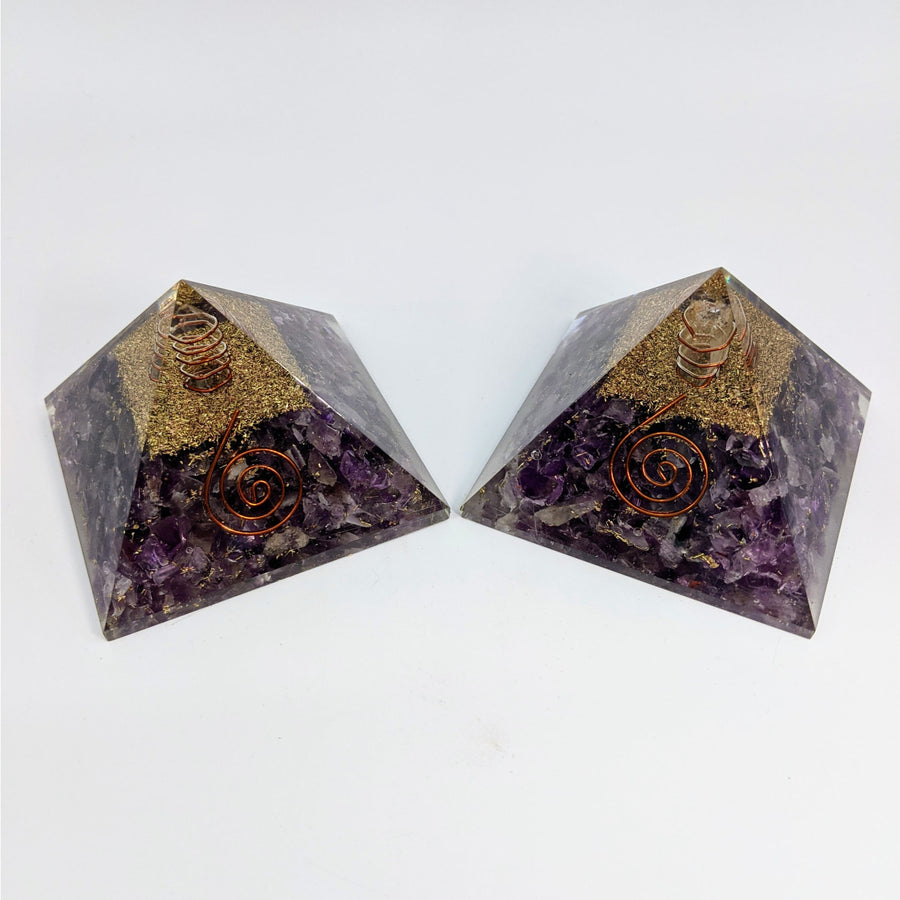 Two Amethyst Orgone Pyramids displayed in the Amethyst 2.75 Inch Orgone Pyramid #LV4667