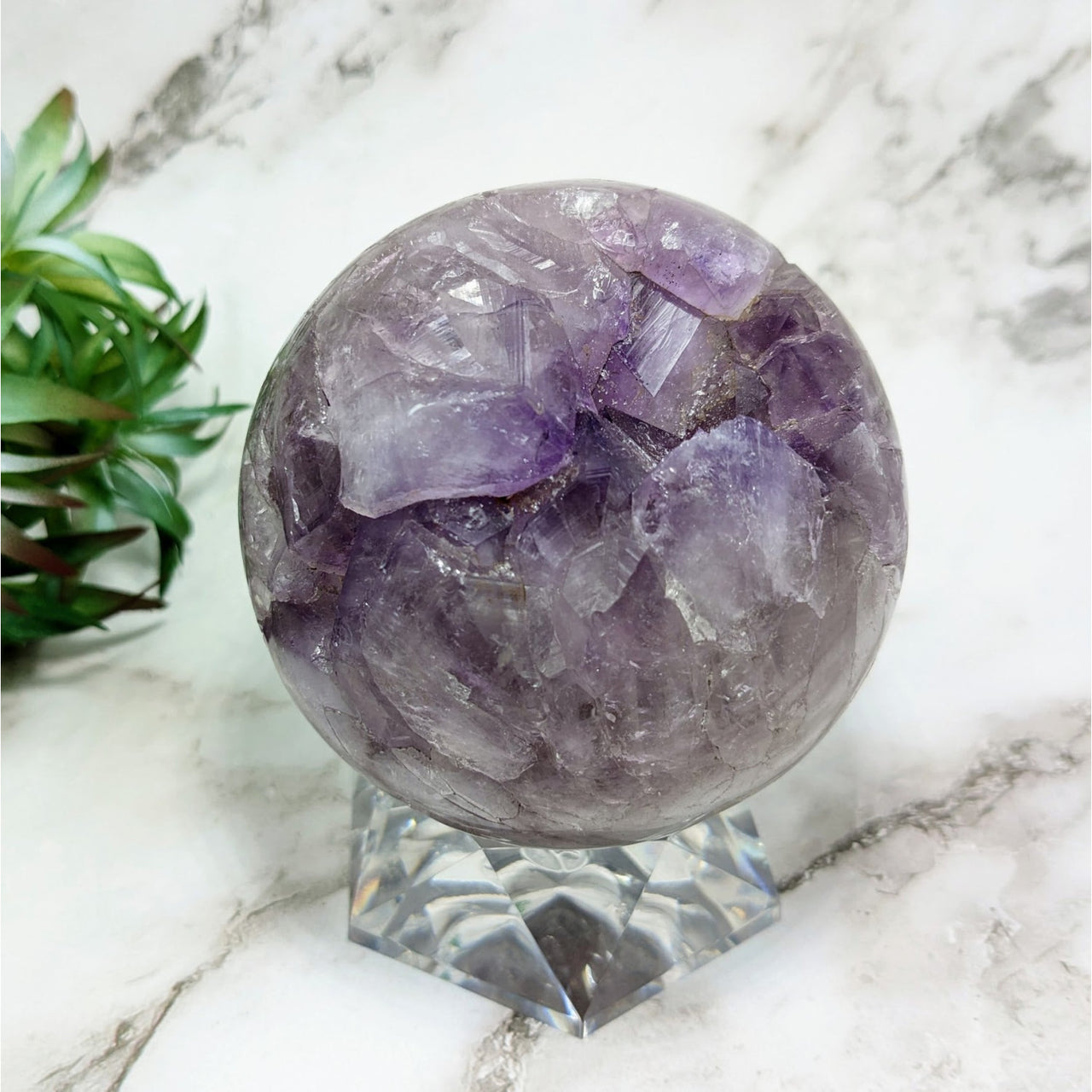 A glowing purple crystal ball on a marble table, Amethyst 3.4’ Sphere #LV4343