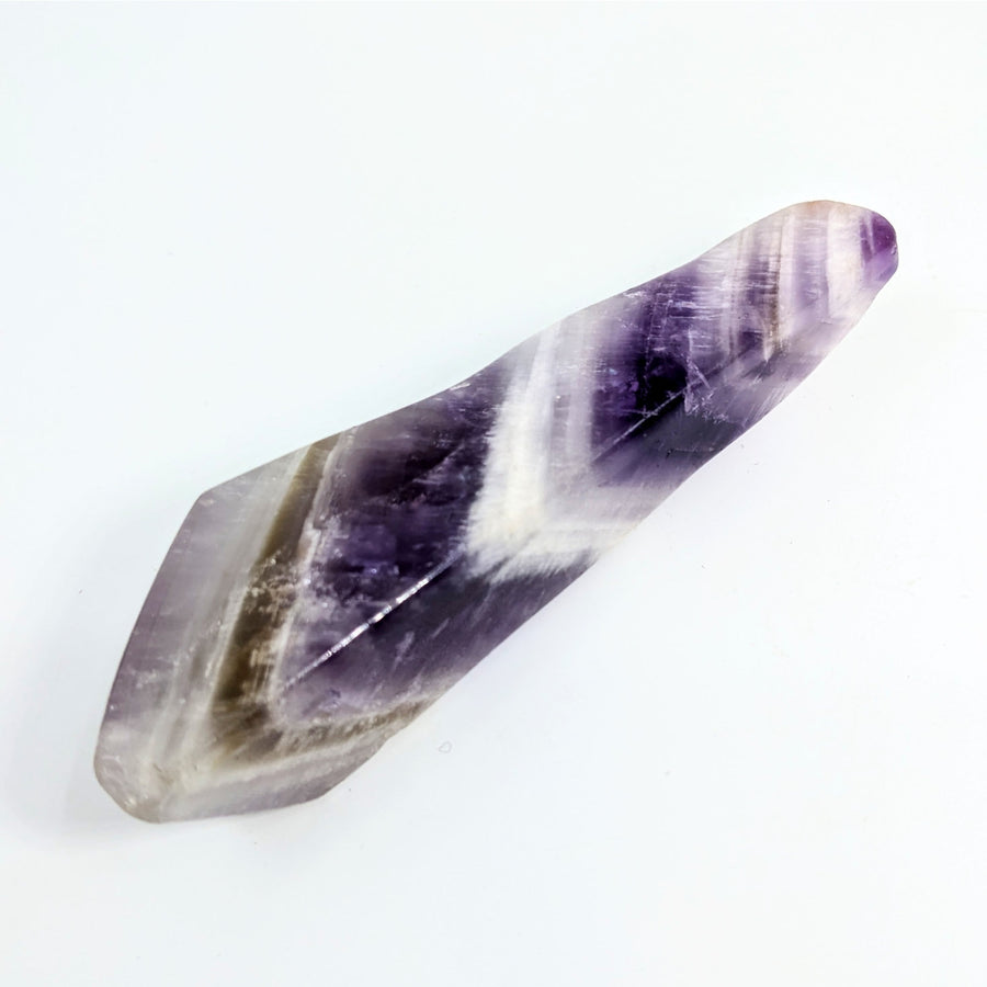 Purple and white crystalline amethyst point with natural striations, 4.6 inches