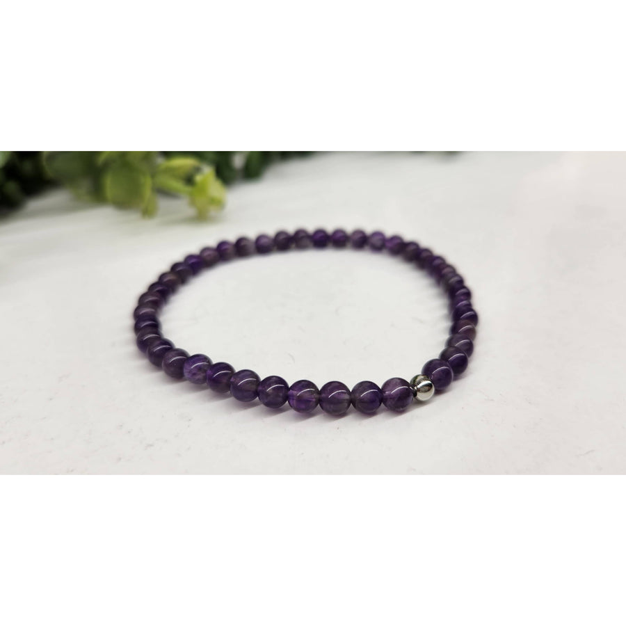 Purple beaded stretchable amethyst bracelet with silver accents from Bliss Crystals