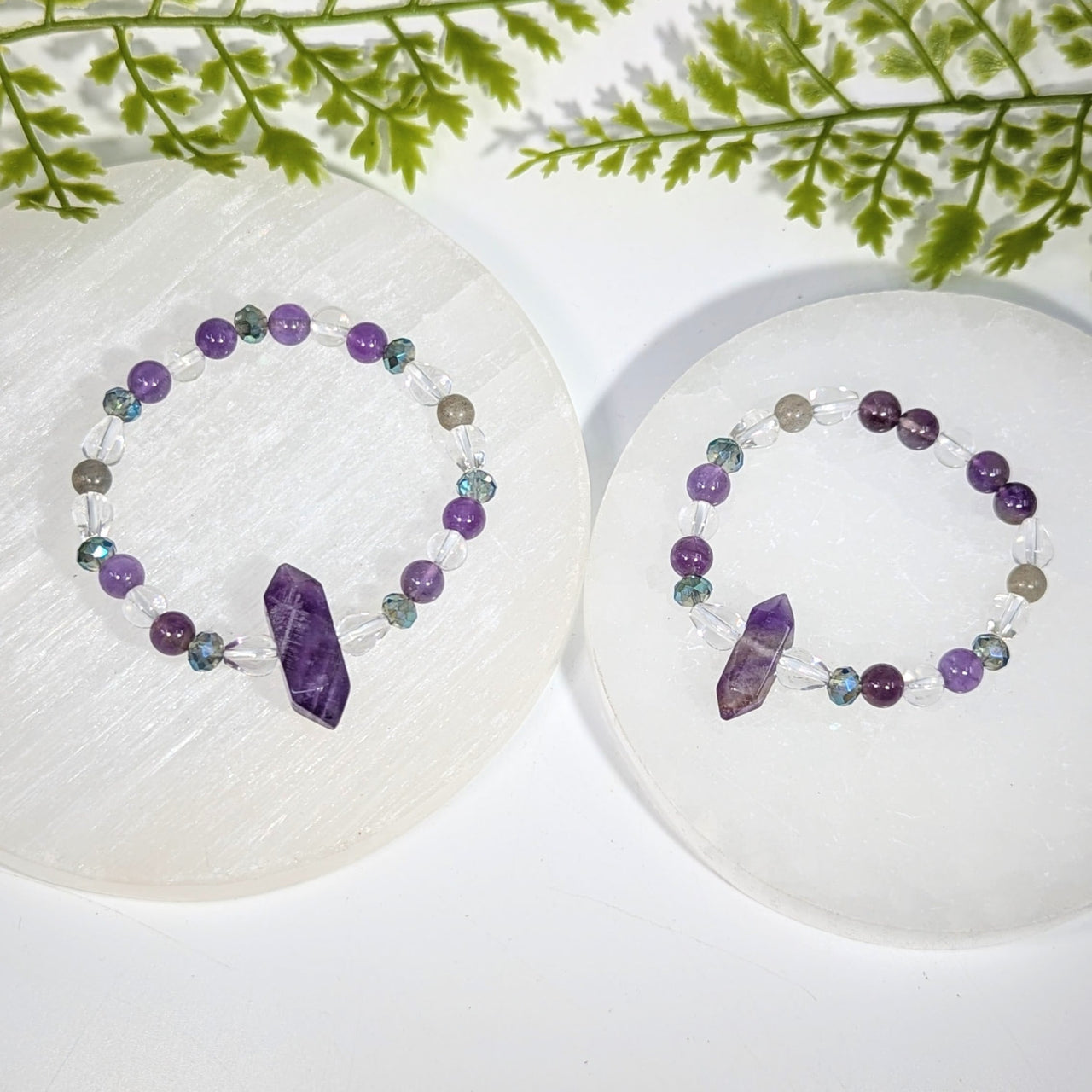 Two purple and clear crystal bead amethyst bracelets featuring faceted gemstones jewelry for elegant wear