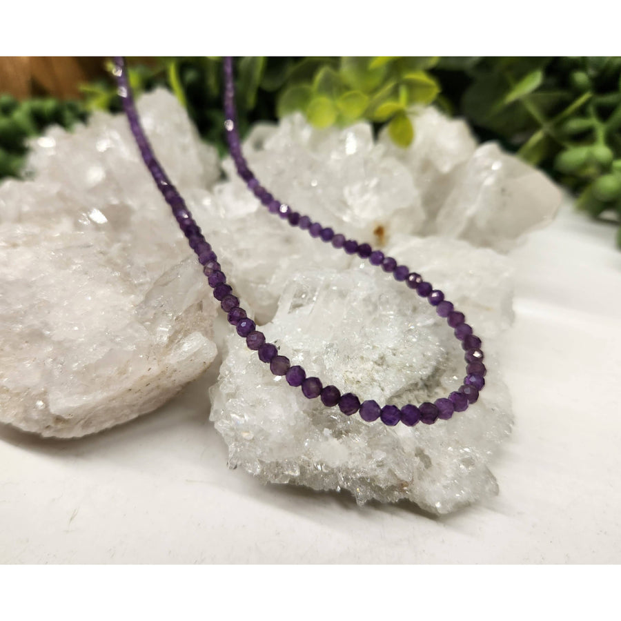 Purple beaded necklace with faceted amethyst stones and silver findings