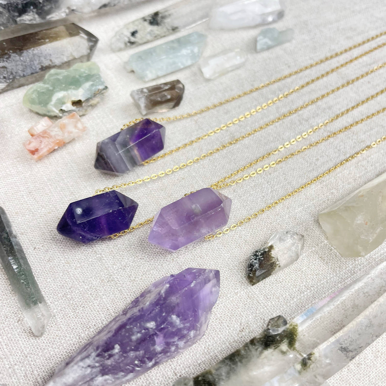 Purple amethyst double terminated point pendant on 18’’ gold chain LV9386