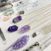 Purple amethyst double terminated point pendant on 18’’ gold chain LV9386