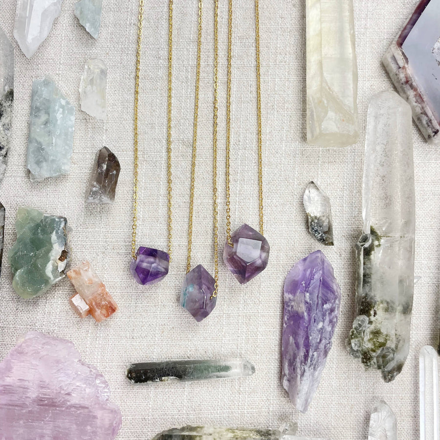 Three delicate gold chain necklaces with unique amethyst double terminated point pendants LV9093