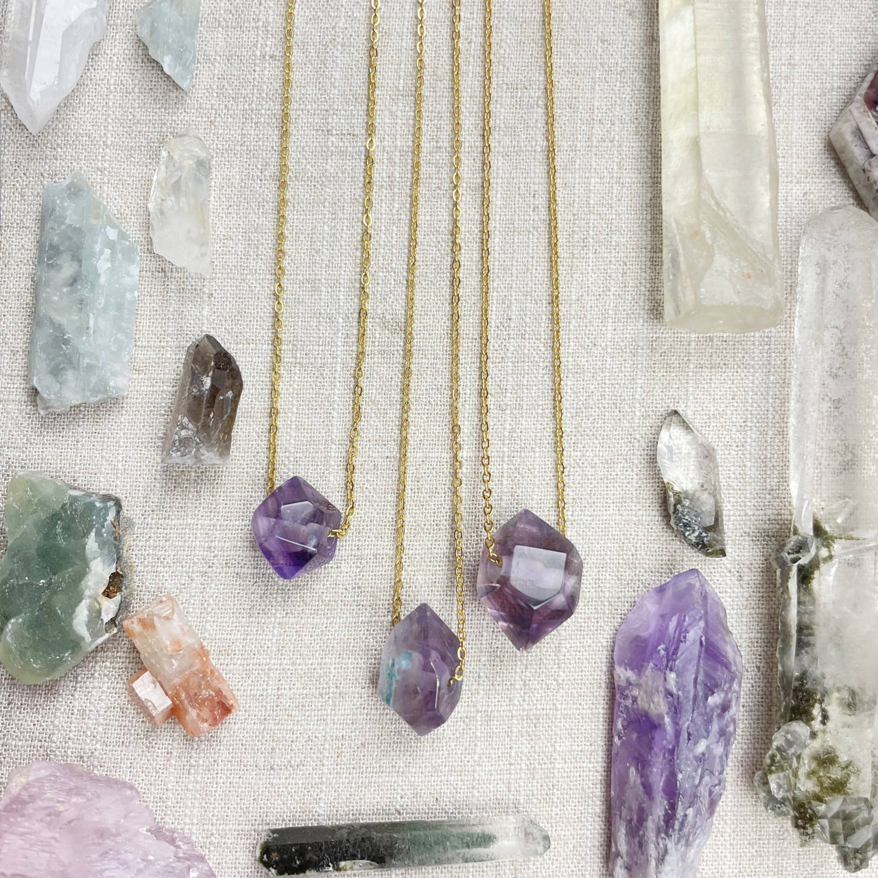 Three delicate gold chain necklaces with unique amethyst double terminated point pendants #LV9093