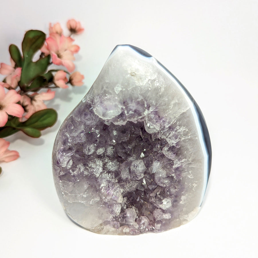 Amethyst geode with white and gray banding in a 4.9-inch Freeform display piece