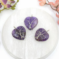 Purple amethyst heart pendant with silver wire-wrapped tree of life design