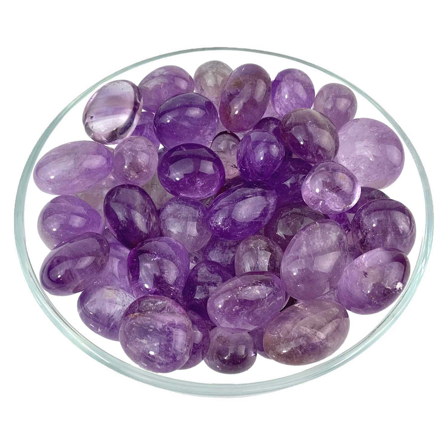 Polished Amethyst stones in a glass dish for 1 Amethyst Round Tumbled Stone