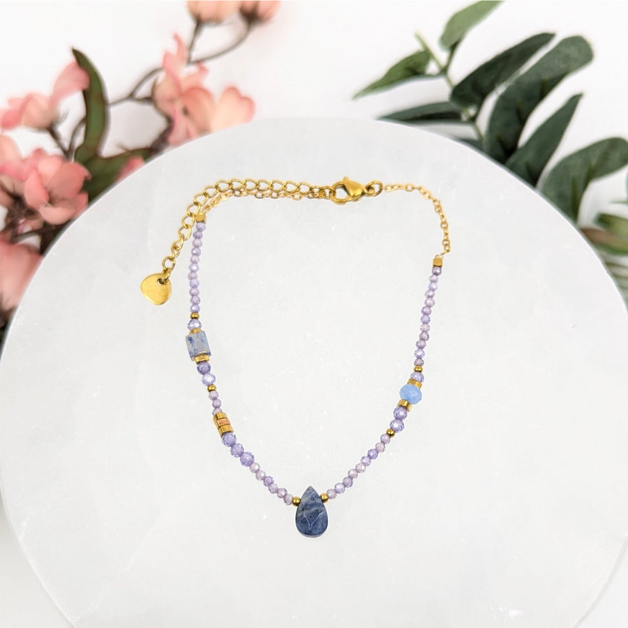 Beaded necklace with teardrop pendant featuring Amethyst and Sodalite stones