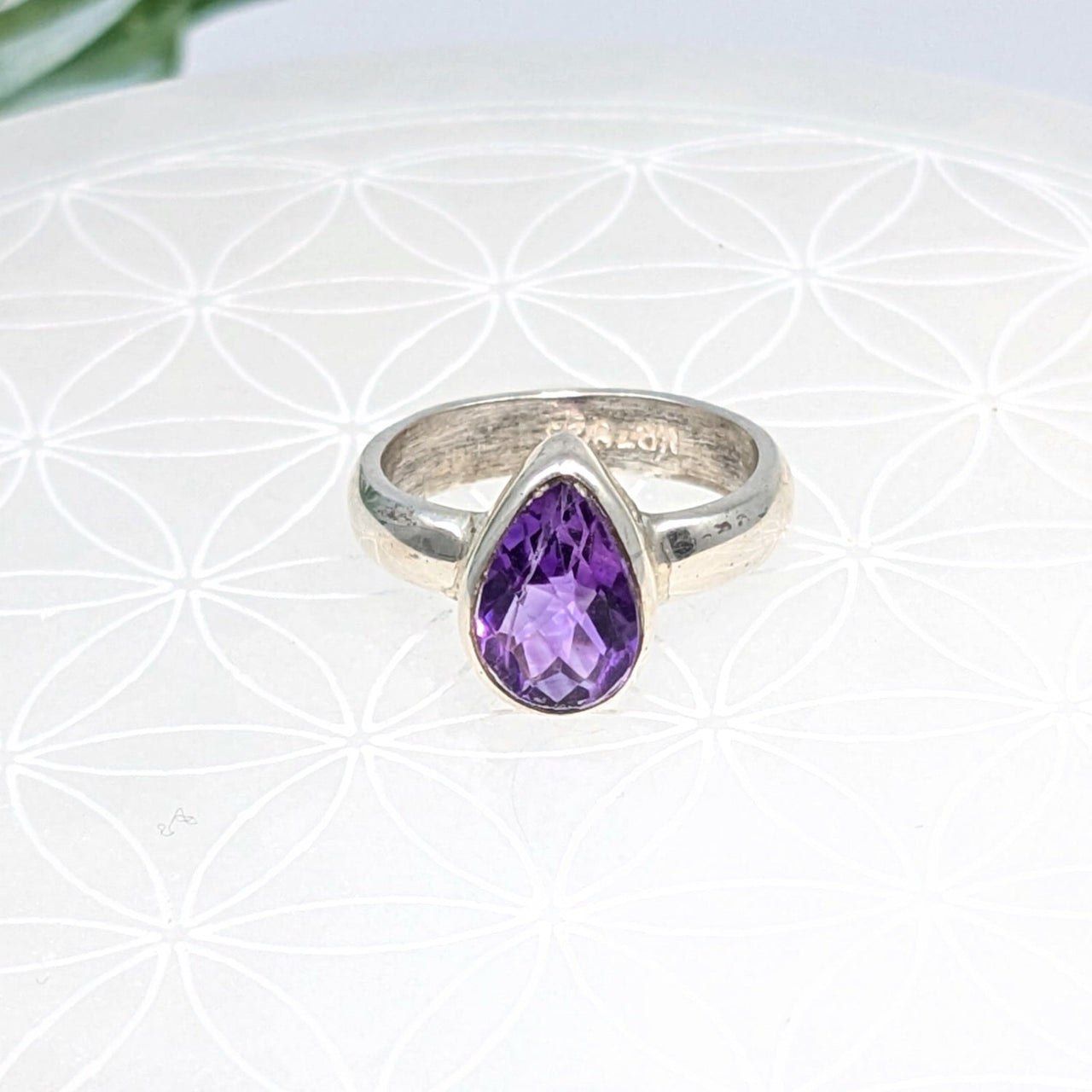 Sterling silver teardrop ring featuring a stunning amethyst gemstone