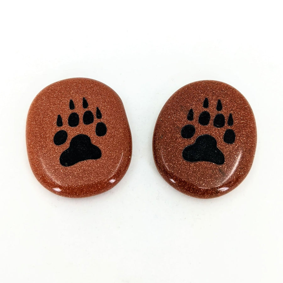 Animal Palm Stone #T389D with two brown and black paw prints on a white background