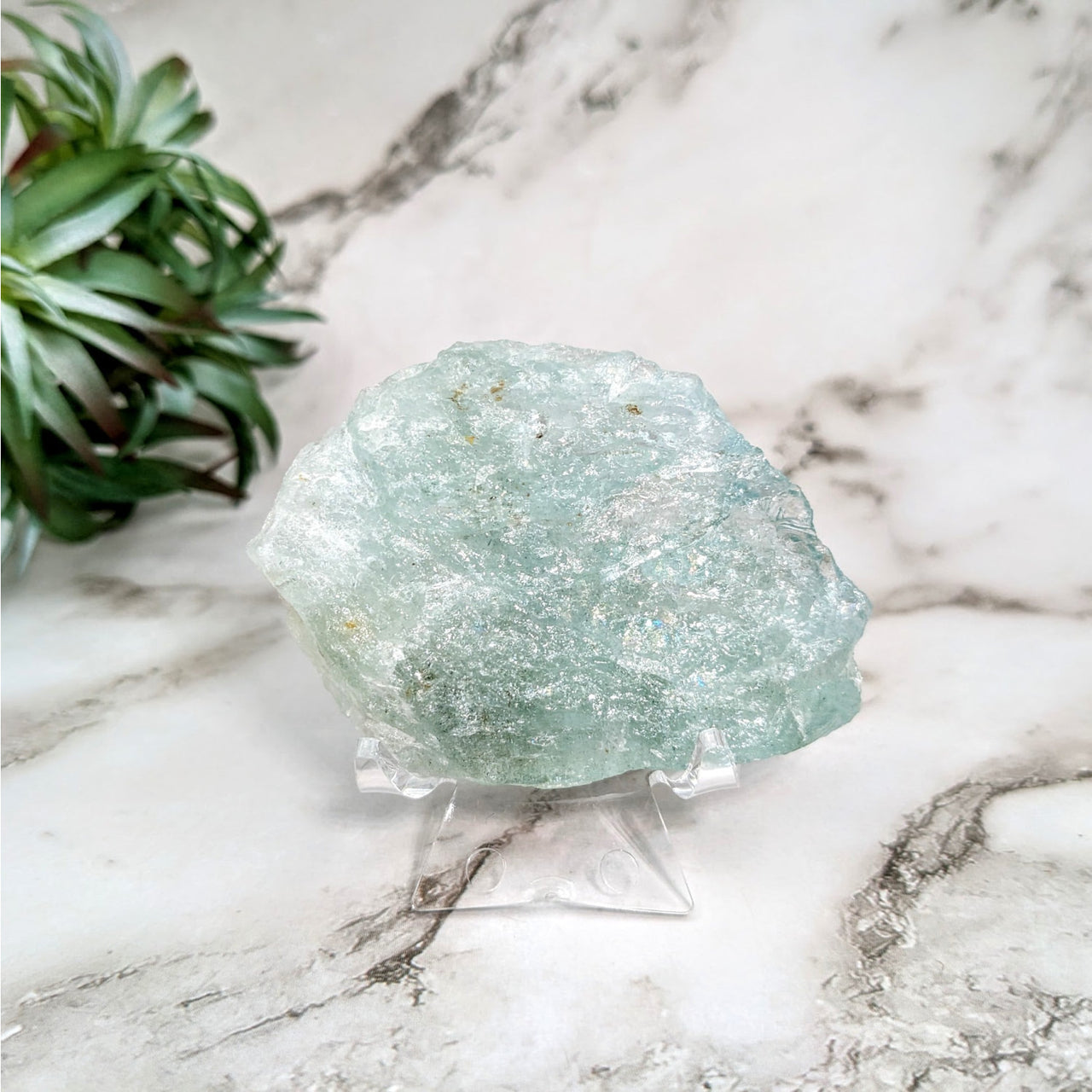 Green quartz stone on marble table - Aquamarine 2.8’ Rough Specimen #LV4626