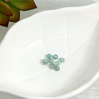 Thumbnail for Light blue-green Aquamarine 3mm mini round beads clustered together in a stylish display