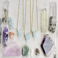 Three light blue jade fox pendants on delicate gold chains, LV9096