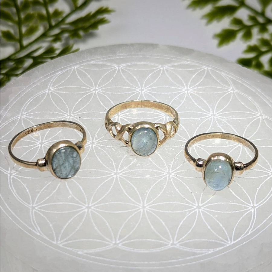 Three delicate gold aquamarine oval rings, bezel set, size #BC0392