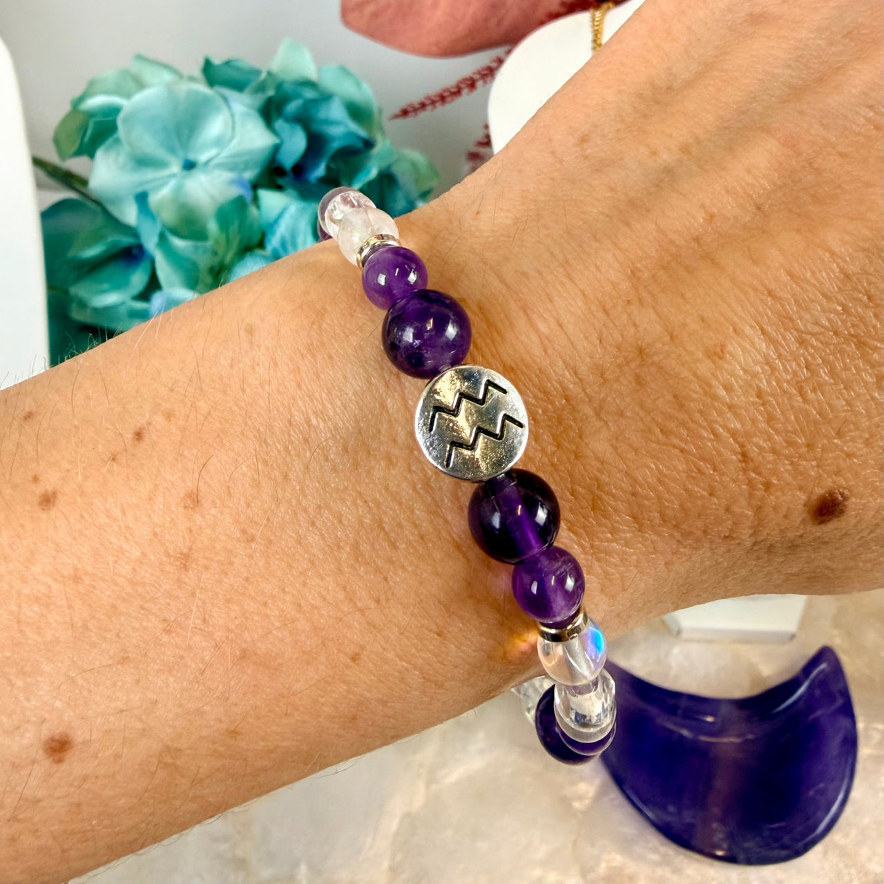 Purple and clear beaded Aquarius zodiac bracelet with silver charm, 7 inch