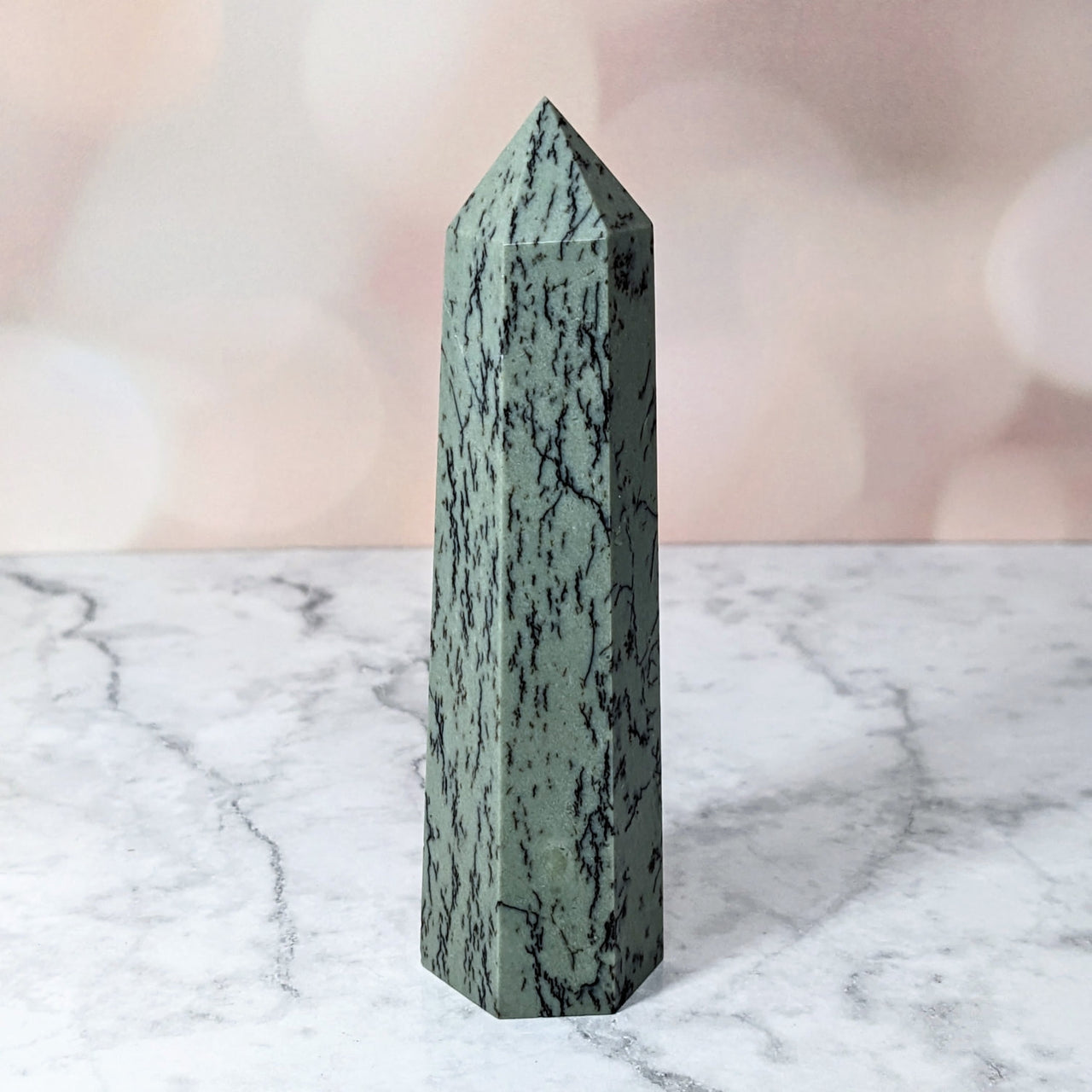 Aquatic Jade 3.8’ Tower #LV2825 - Green Quartz Point on Marble Table