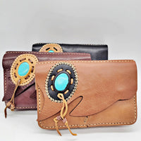 Tan leather crossbody clutch with turquoise stone centerpiece