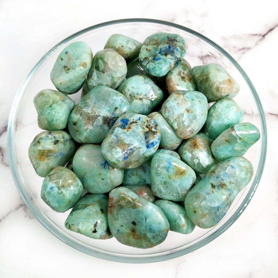 Polished green chrysoprase stones in a bowl for Azurite in Green Moonstone product